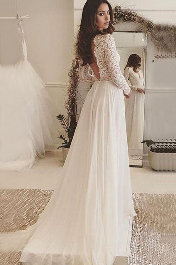 Back view of ivory A-line chiffon wedding dress showing backless design and lace.