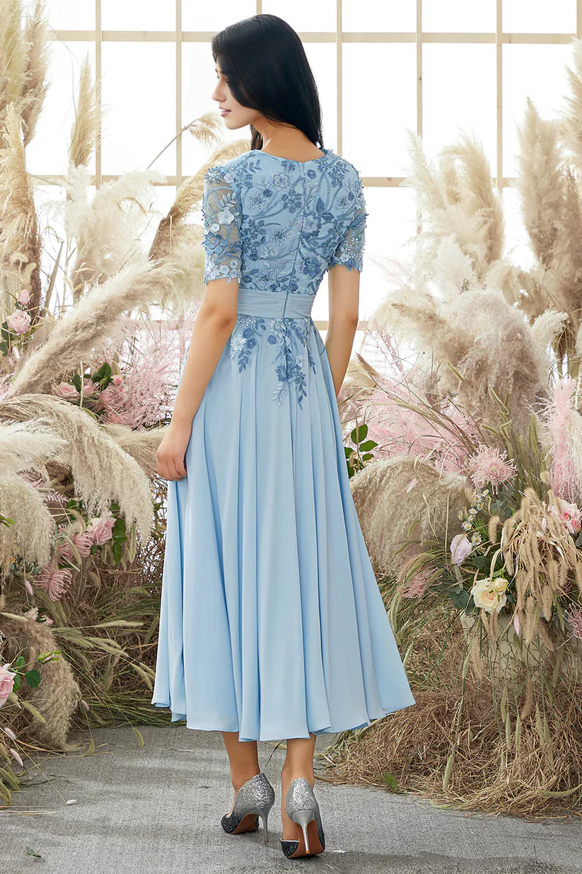 Side view of A-line V-neck formal gown with delicate appliques.