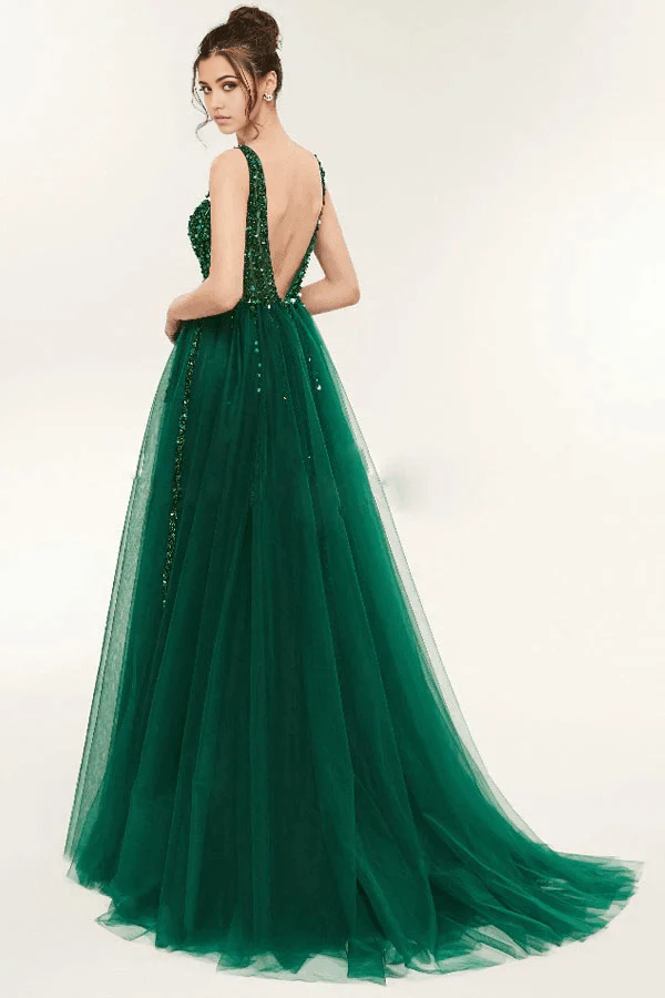 Back view of a green A-line prom dress showing the open back and sequin details.