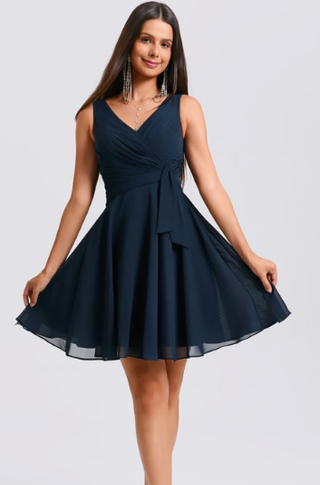 Woman wearing a short A-line V-neck pleated homecoming dress.