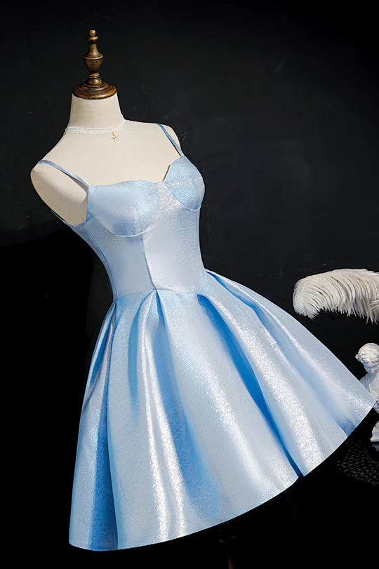 Close-up of the pleated detail on a blue A-line dress.