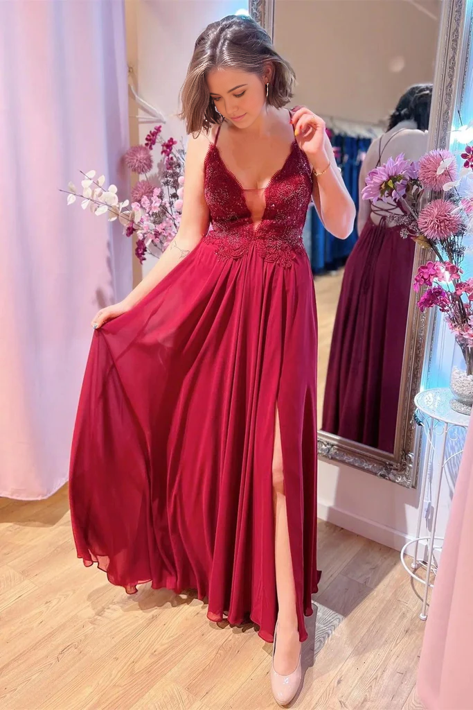Elegant A-line V-neck burgundy prom dress with plunging neckline, beaded appliques, and a high slit.