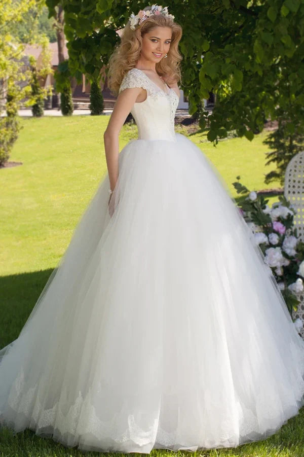 Full view of an elegant A-line V-neck tulle ball gown wedding dress.