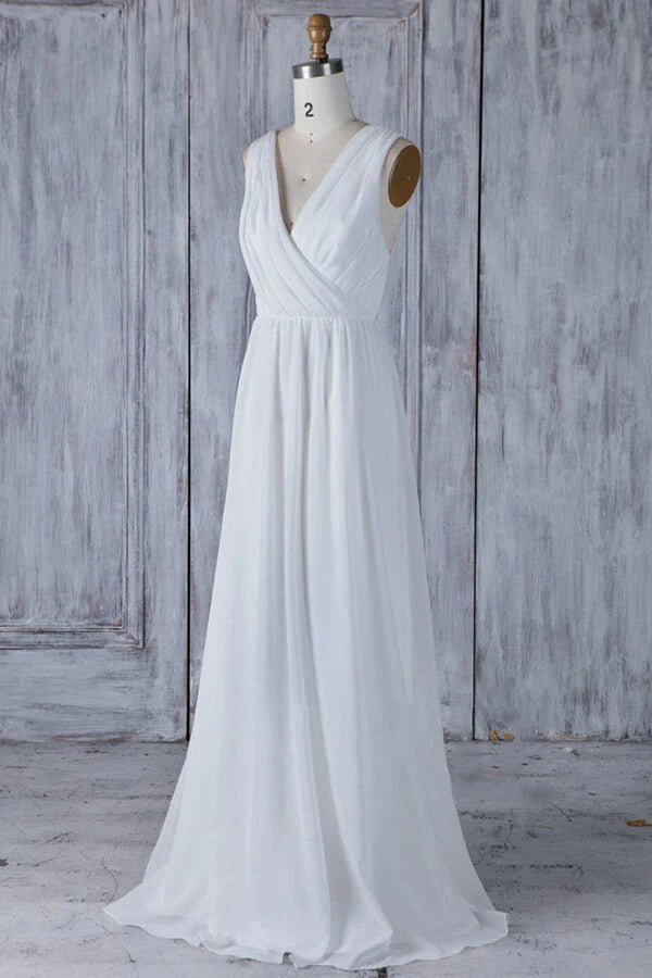 Elegant A-line V-neck wedding dress with ruffle lace and flowing chiffon.