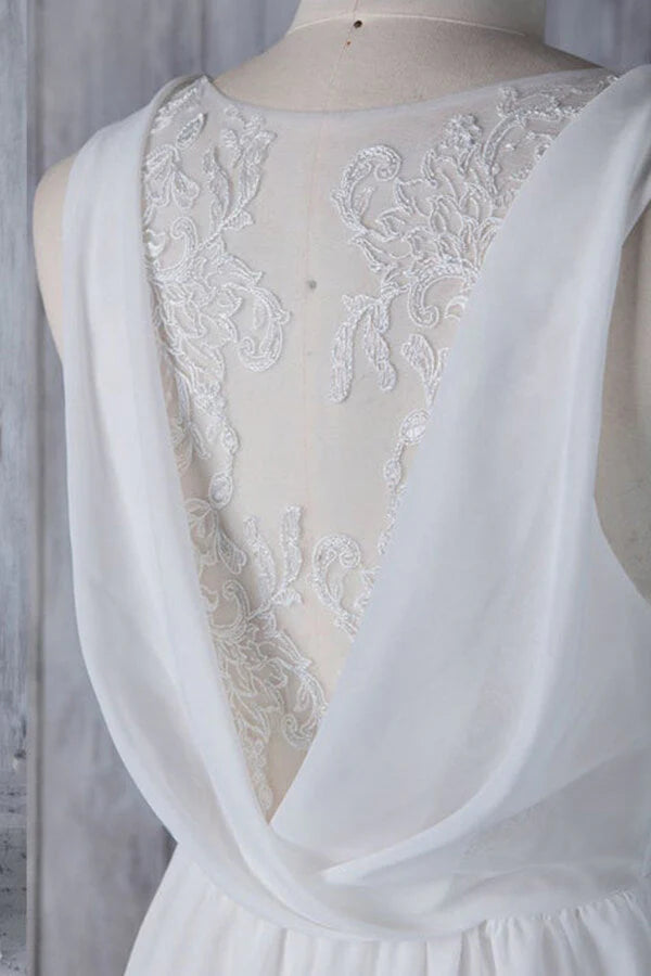 Side view of the long A-line wedding dress, showcasing its flowing silhouette.