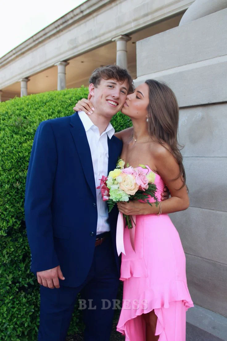 Full view of a pink A-line prom dress featuring ruffles and a stylish split.