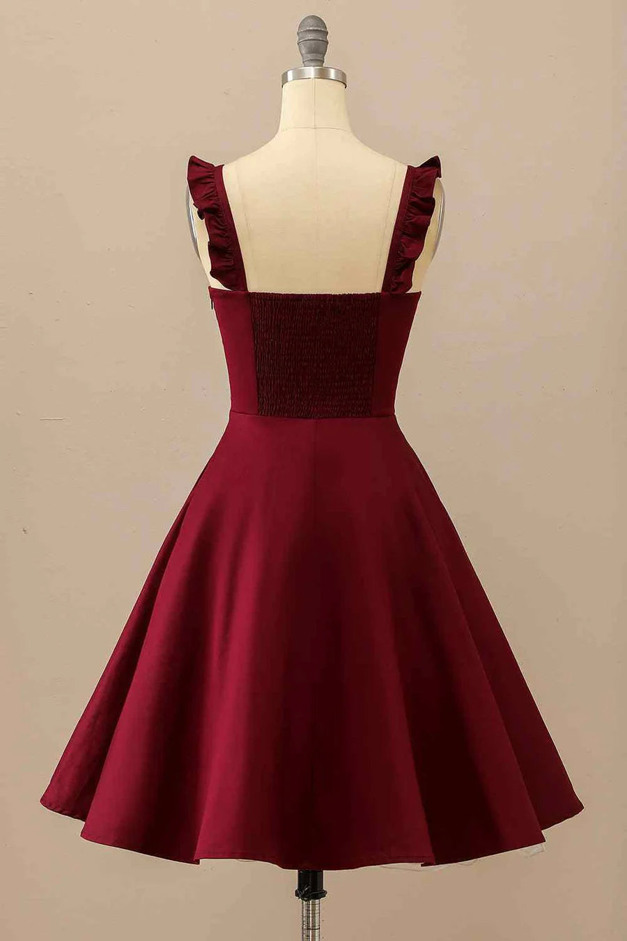 Side view of A-line satin mini homecoming dress with ruffle straps.