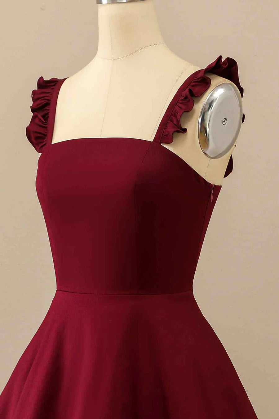 Back view of A-line satin mini homecoming dress with ruffle straps.