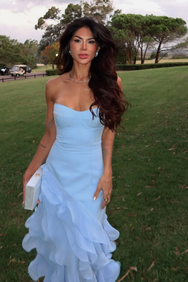 Back view of the blue satin chiffon prom dress, showcasing ruffled details.
