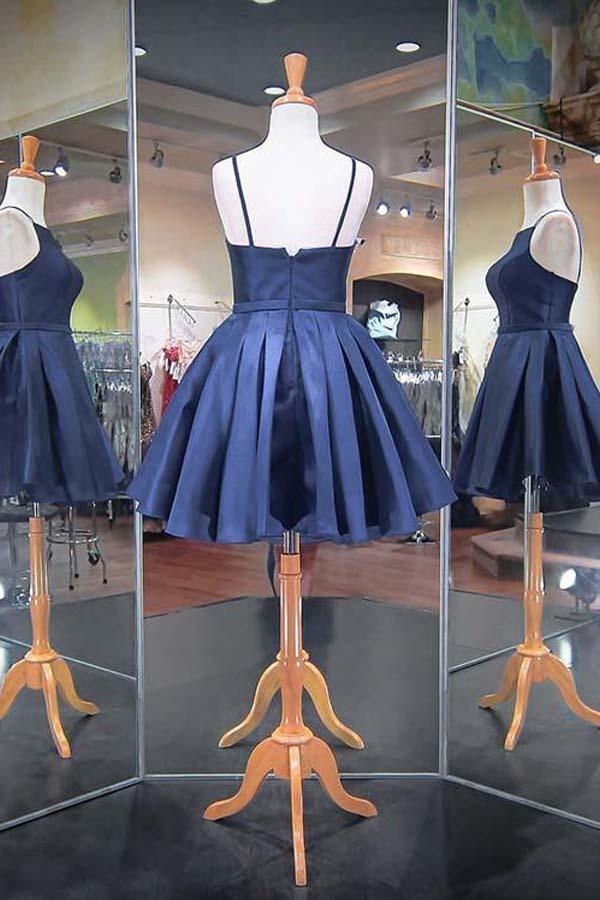Back view of a navy blue A-line satin dress.
