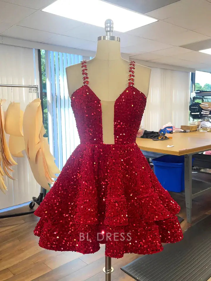 Elegant A-line V-neck sequin dress with layered skirt.