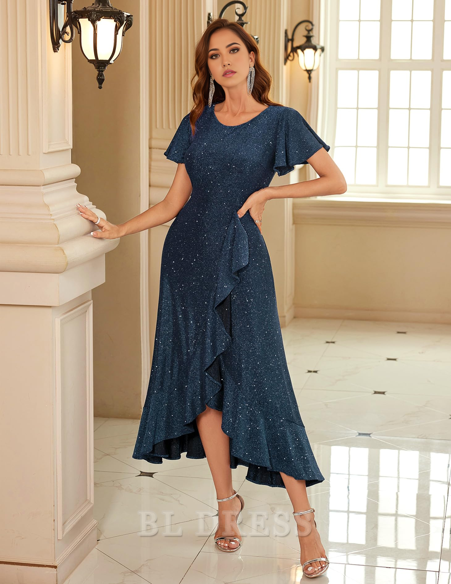Side view of the V-neck short sleeve sequin evening gown.