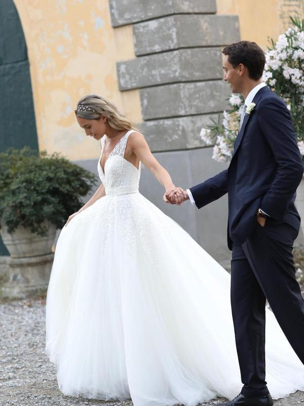 Side view of the A-line wedding dress, showcasing the flowing chapel train.
