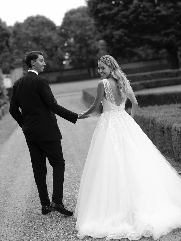 Full length view of the A-line wedding dress, emphasizing its graceful silhouette and train.