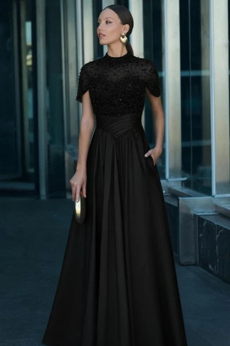 Model posing in the dark green satin A-line dress, showcasing its elegant design.