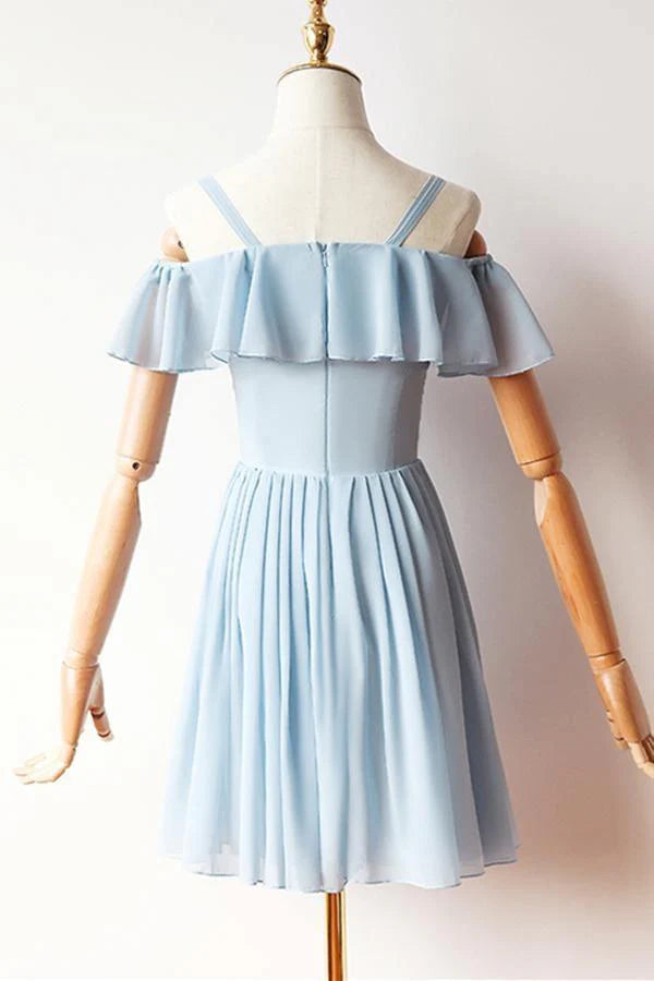 Close-up of the delicate blue chiffon fabric and short sleeves of the A-line dress.