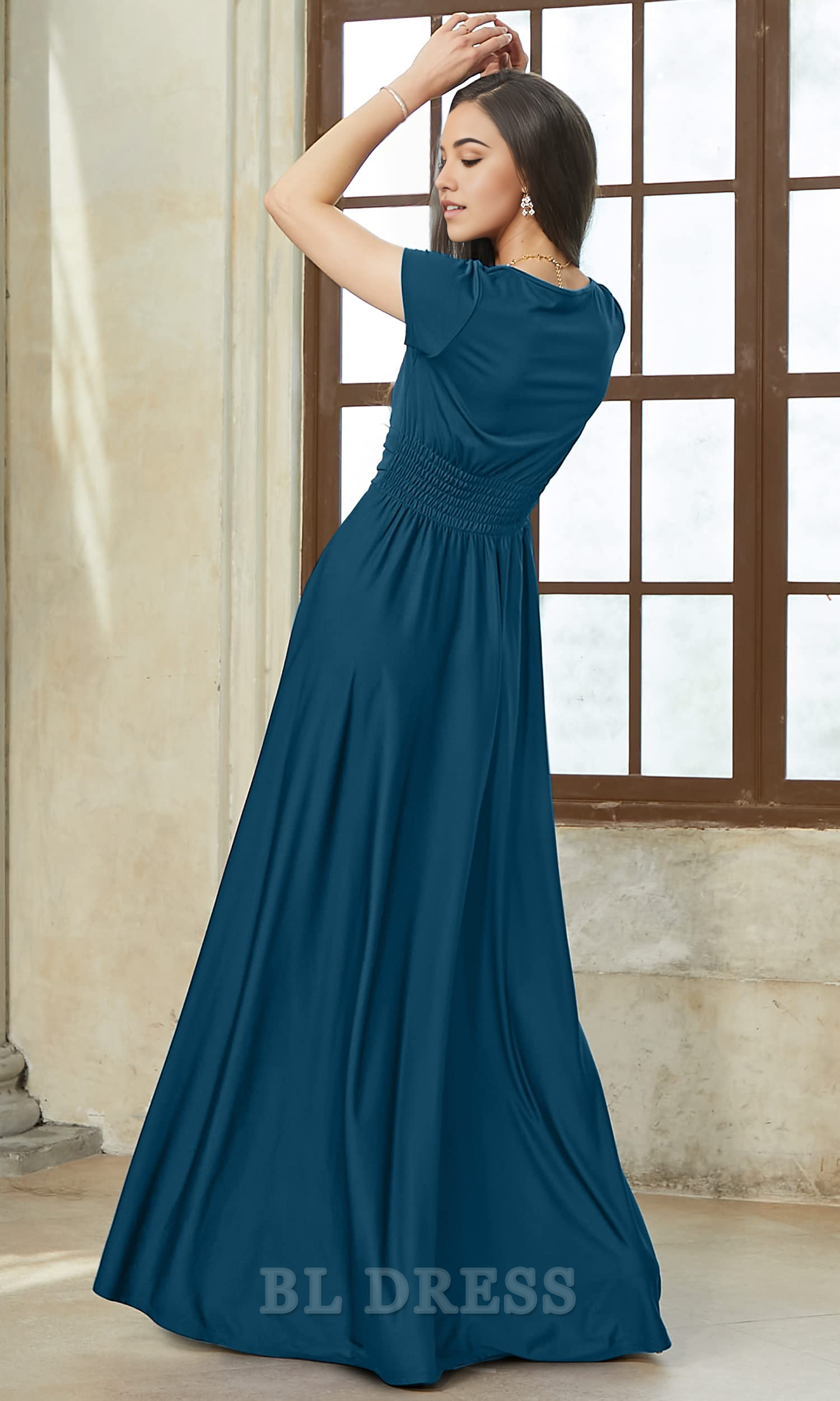 Back view of a woman in a dark blue A-line V-neck short sleeve dress.