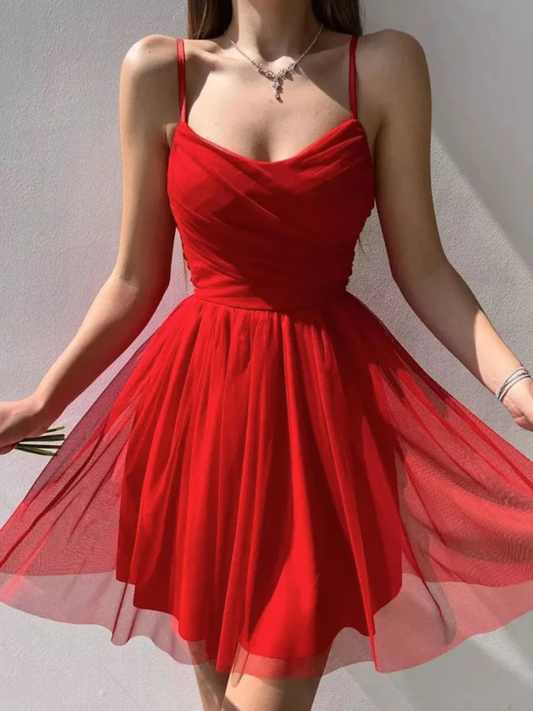 Woman wearing an elegant A-line V-neck short tulle prom dress.