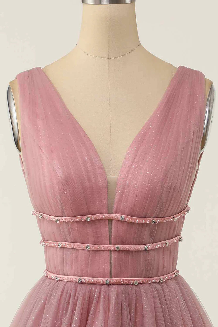 Model wearing the A-line V-neck sleeveless beaded dress, showcasing its flow.
