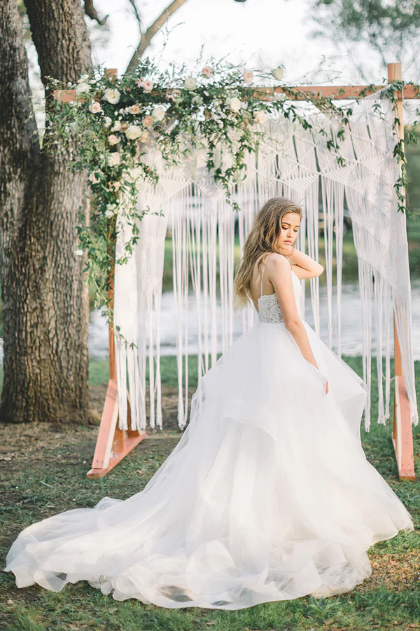 Back view of A-line V-neck wedding dress with flowing train.