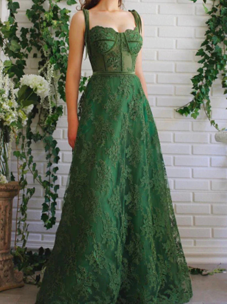 Model wearing an elegant A-line V-neck lace applique prom dress.