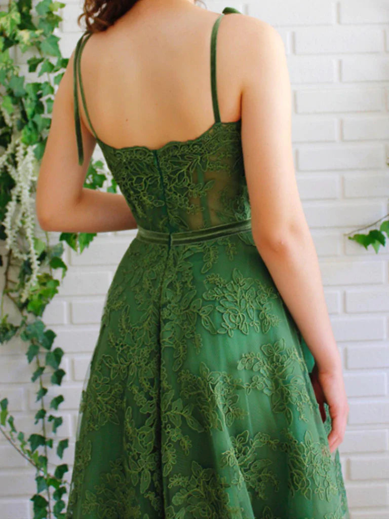 Front view of the sleeveless A-line prom dress with lace appliques.
