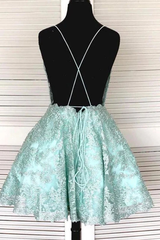 Back view of A-line formal dress featuring intricate lace and open back.