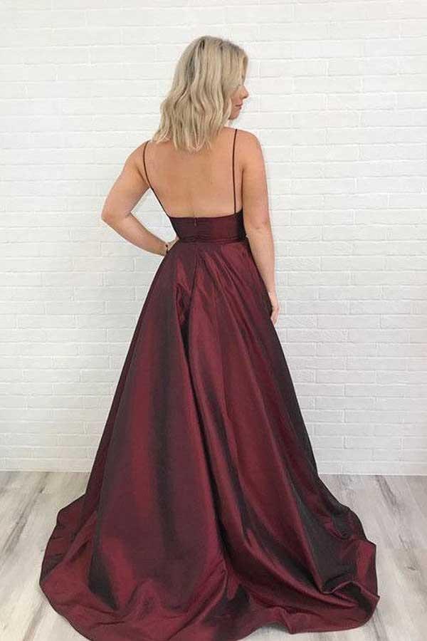 Burgundy satin A-line gown with V-neckline, side view.