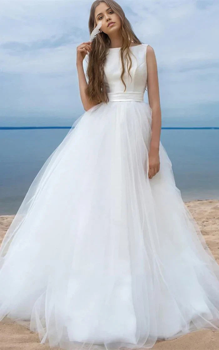 Elegant A-line V-neck sleeveless wedding gown with a large bow on the back.
