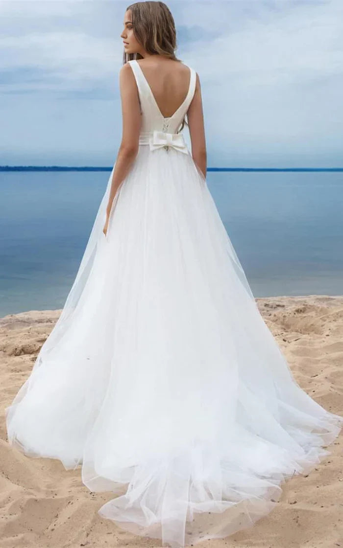Back view of the A-line wedding gown, showcasing the elegant bow and ribbon detail.