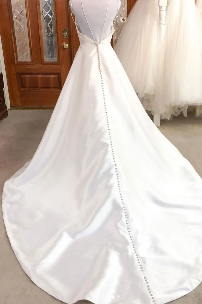 Sleeveless A-line satin bridal gown with V-neckline.