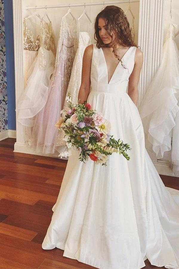 Elegant A-line ivory satin wedding dress with V-neckline.