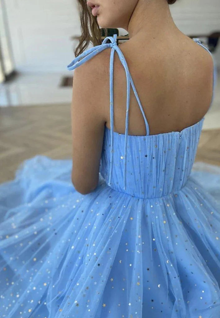 Close-up of blue A-line tulle sequin tea length dress.