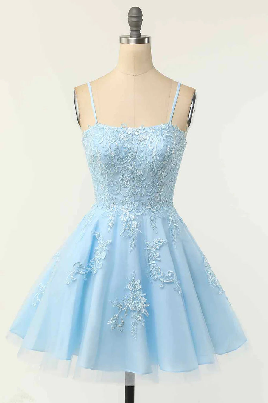 Elegant A-line homecoming dress with spaghetti straps and V-neckline.