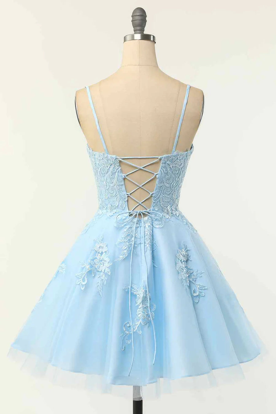 Back view of A-line homecoming dress showing lace-up detail and applique.
