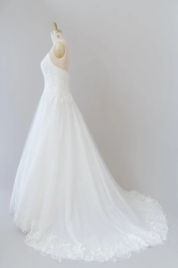 Side profile of the long A-line bridal dress.