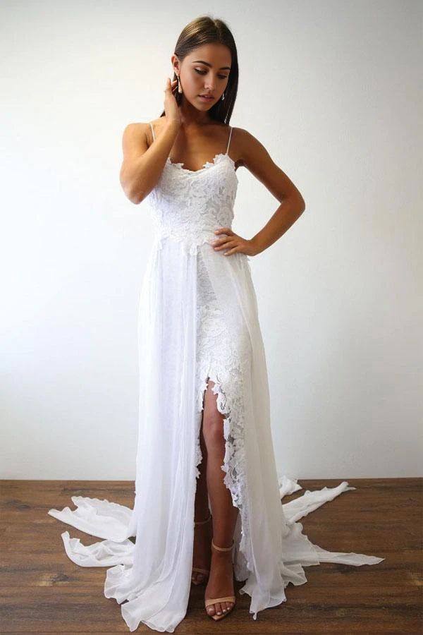 Elegant white A-line wedding dress with spaghetti straps on a model.