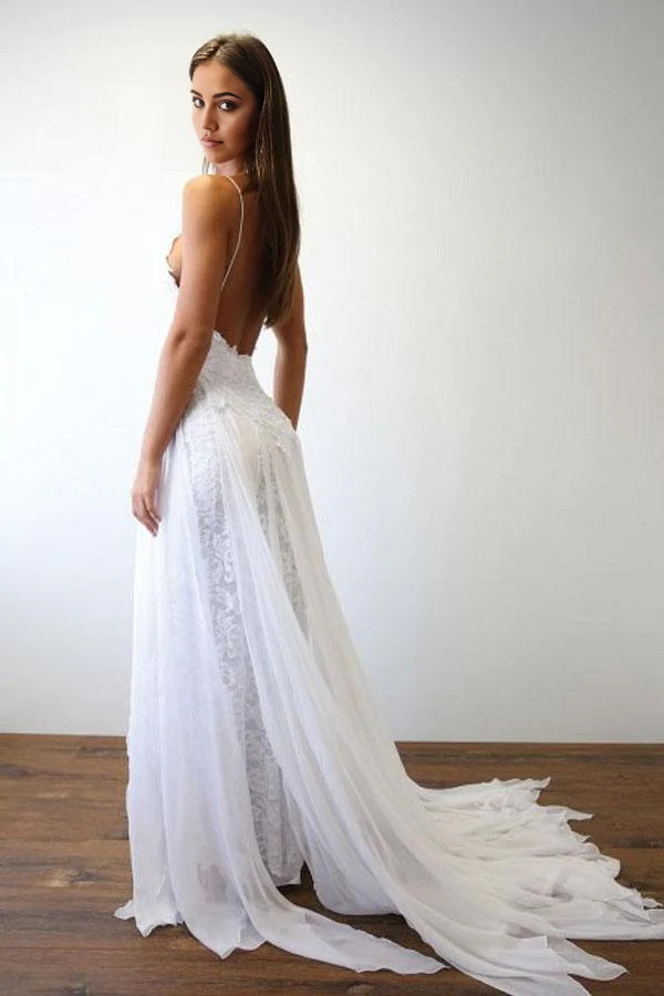 Back view of the long white A-line wedding dress with flowing skirt.