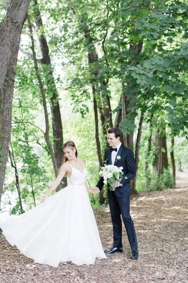 Graceful V-neck A-line wedding dress for brides.