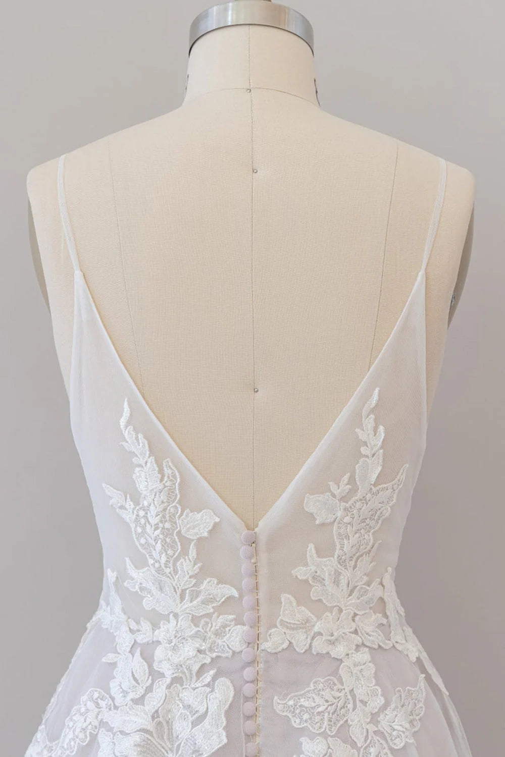 Bride wearing the long A-line tulle wedding dress with spaghetti straps.