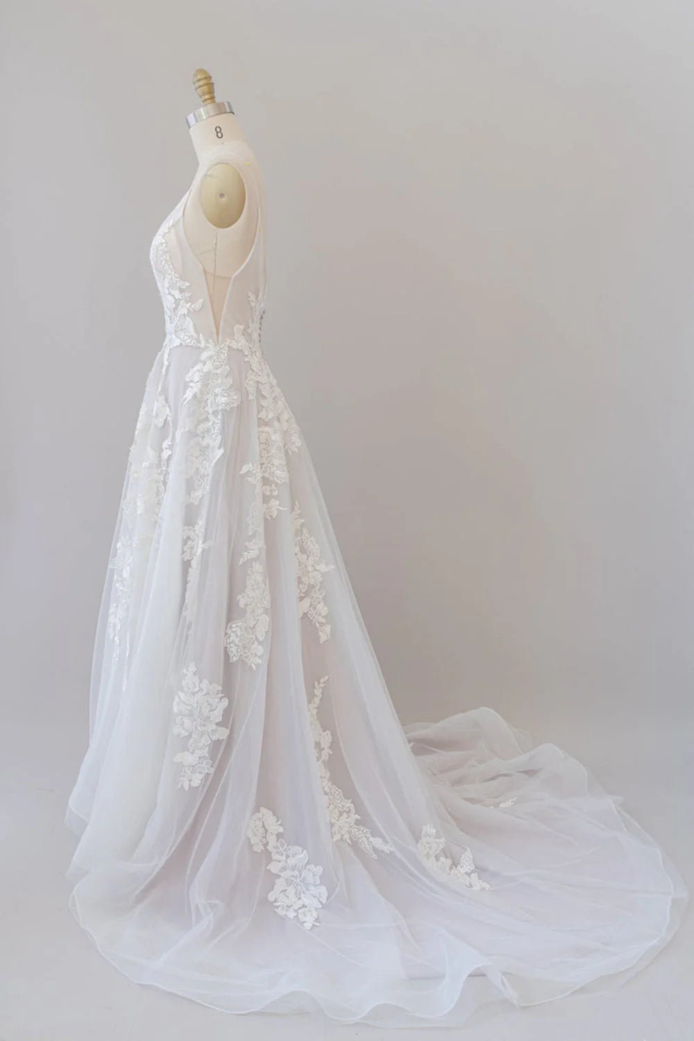 Full length view of the elegant A-line wedding gown.