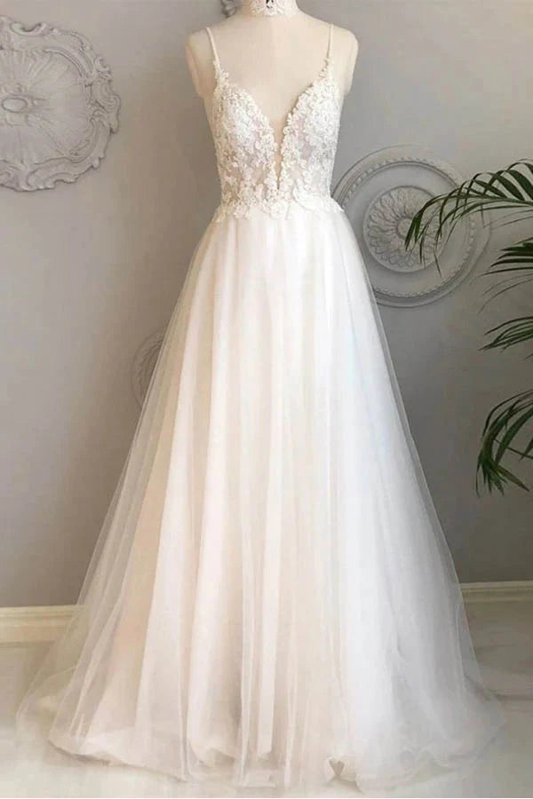 Elegant A-line lace wedding dress with spaghetti straps and V-neck.