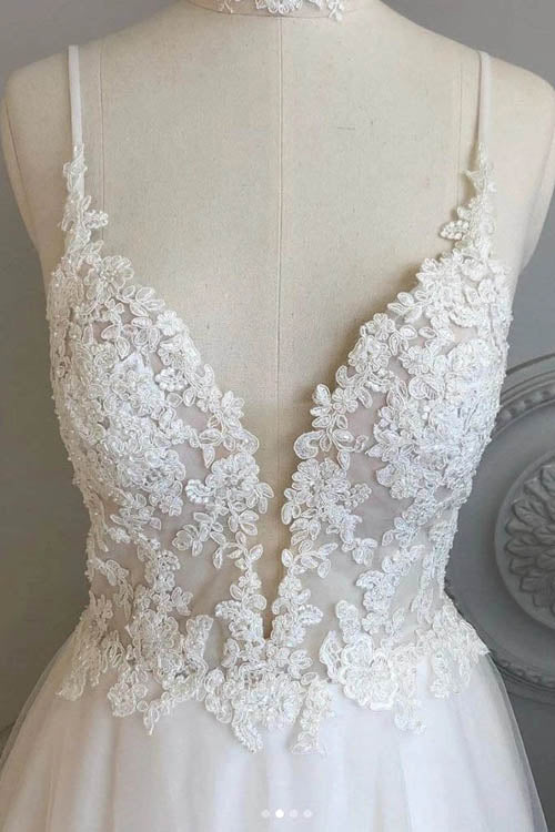 Close-up of intricate lace detailing on the A-line wedding dress.