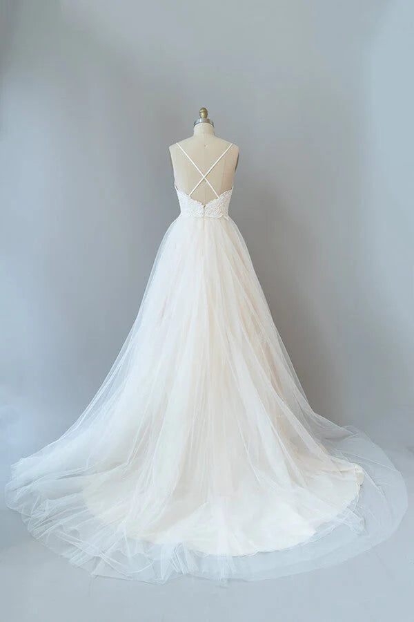 Back view of an A-line wedding dress showing the backless design.