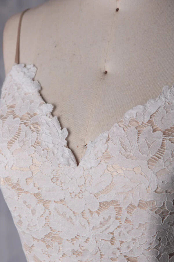 Full view of a short A-line wedding dress with a flowing tulle skirt.
