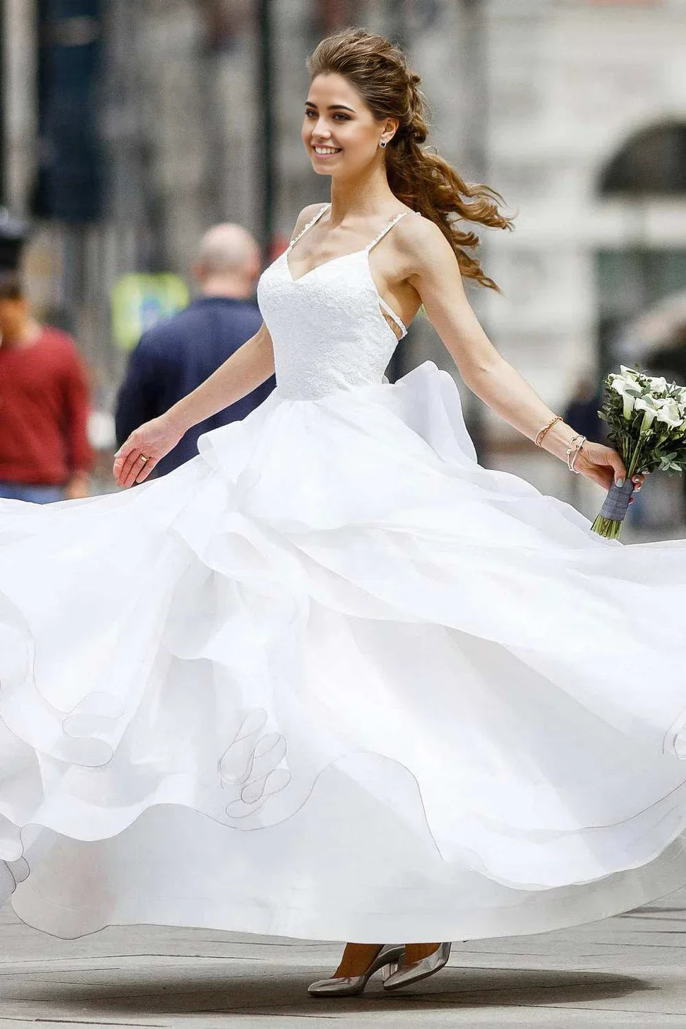 Back view of a layered A-line wedding dress.