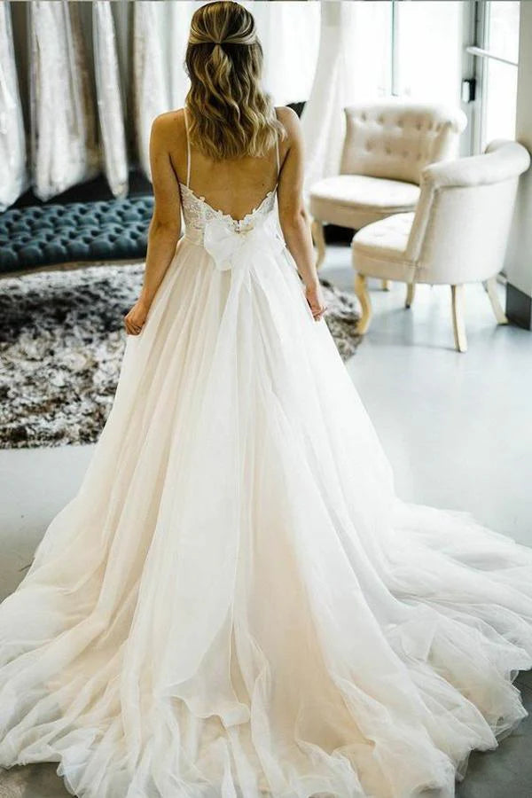 Romantic princess style wedding dress with delicate spaghetti straps.