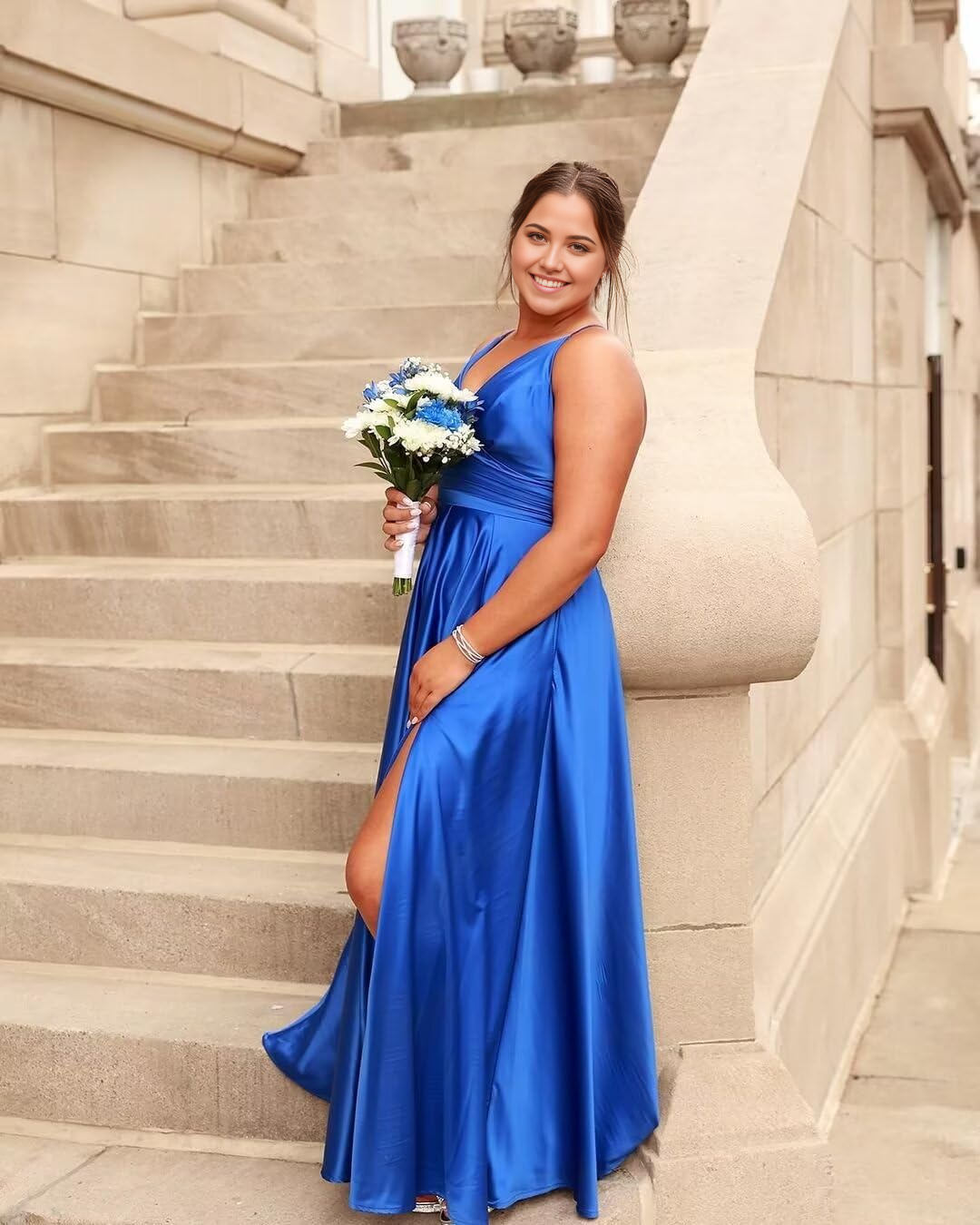 Graceful satin bridesmaid or prom gown with V-neck and A-line silhouette.