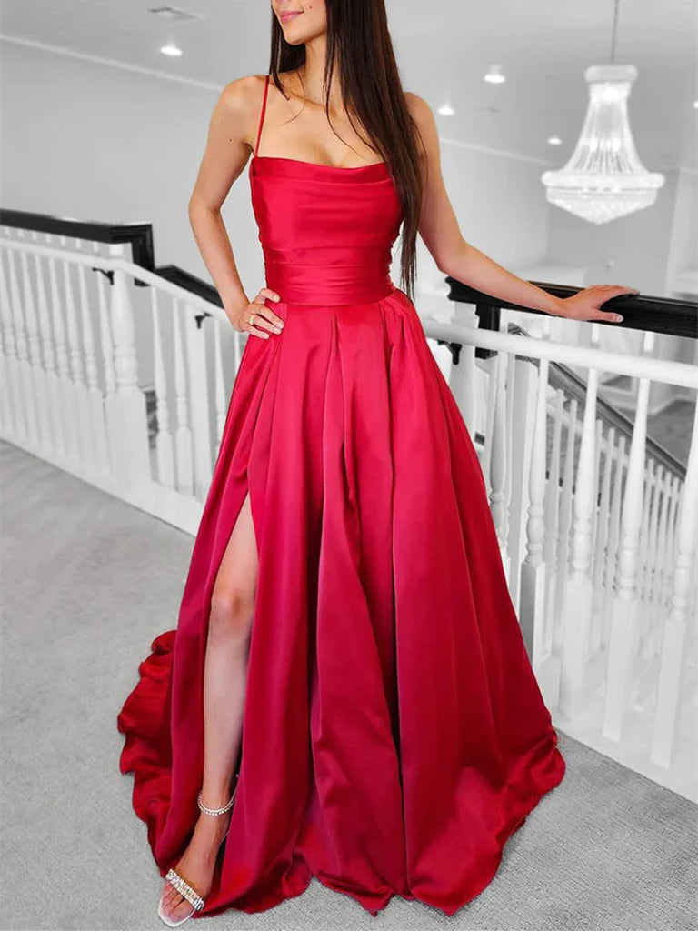 Woman wearing an elegant blue A-line satin prom dress with spaghetti straps and a V-neckline.