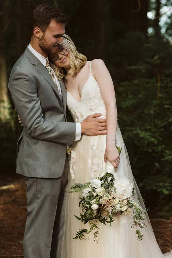 Back view of the A-line V-neck bridal gown with delicate lace details.